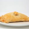 A chigan leek and potato pasty on a plate